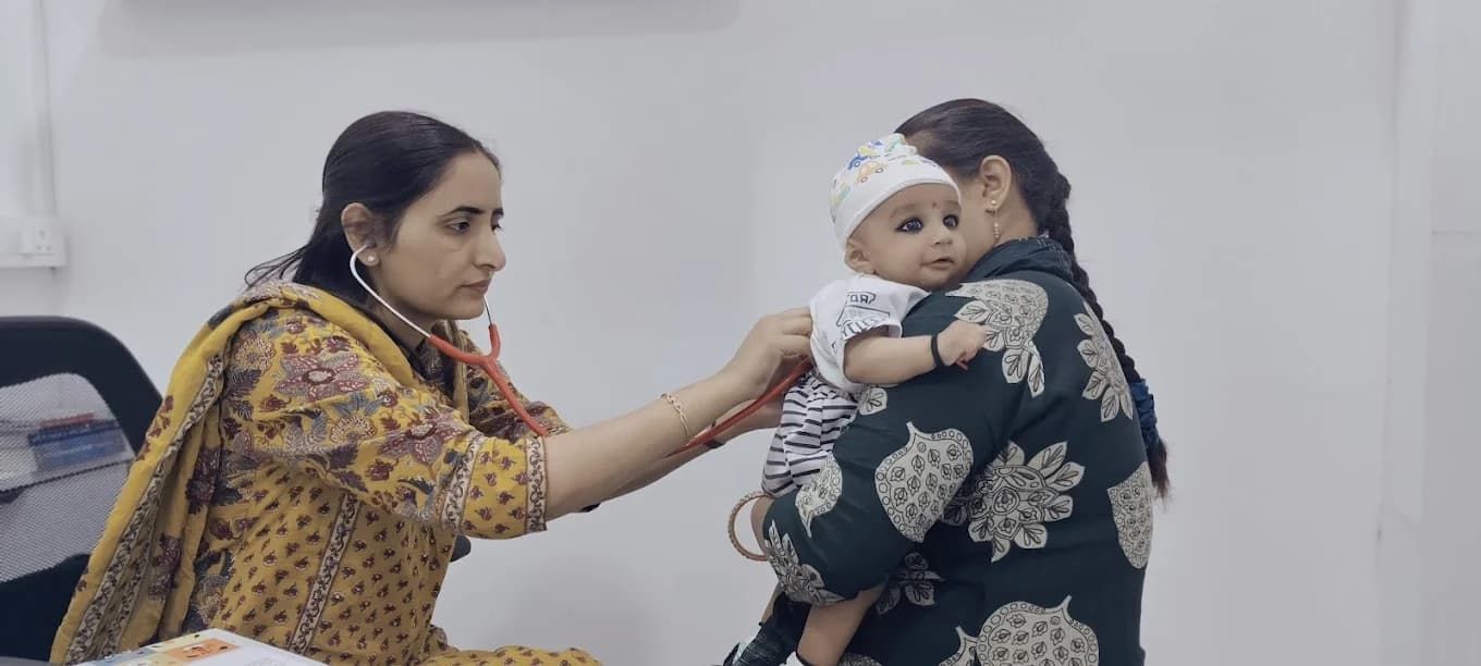 Dr. Manisha examining infant